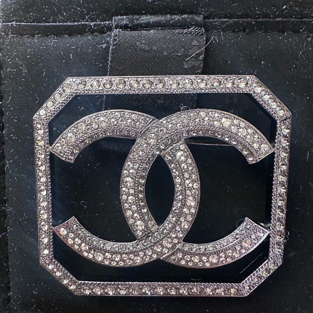CHANEL Silver and Crystal Logo Brooch